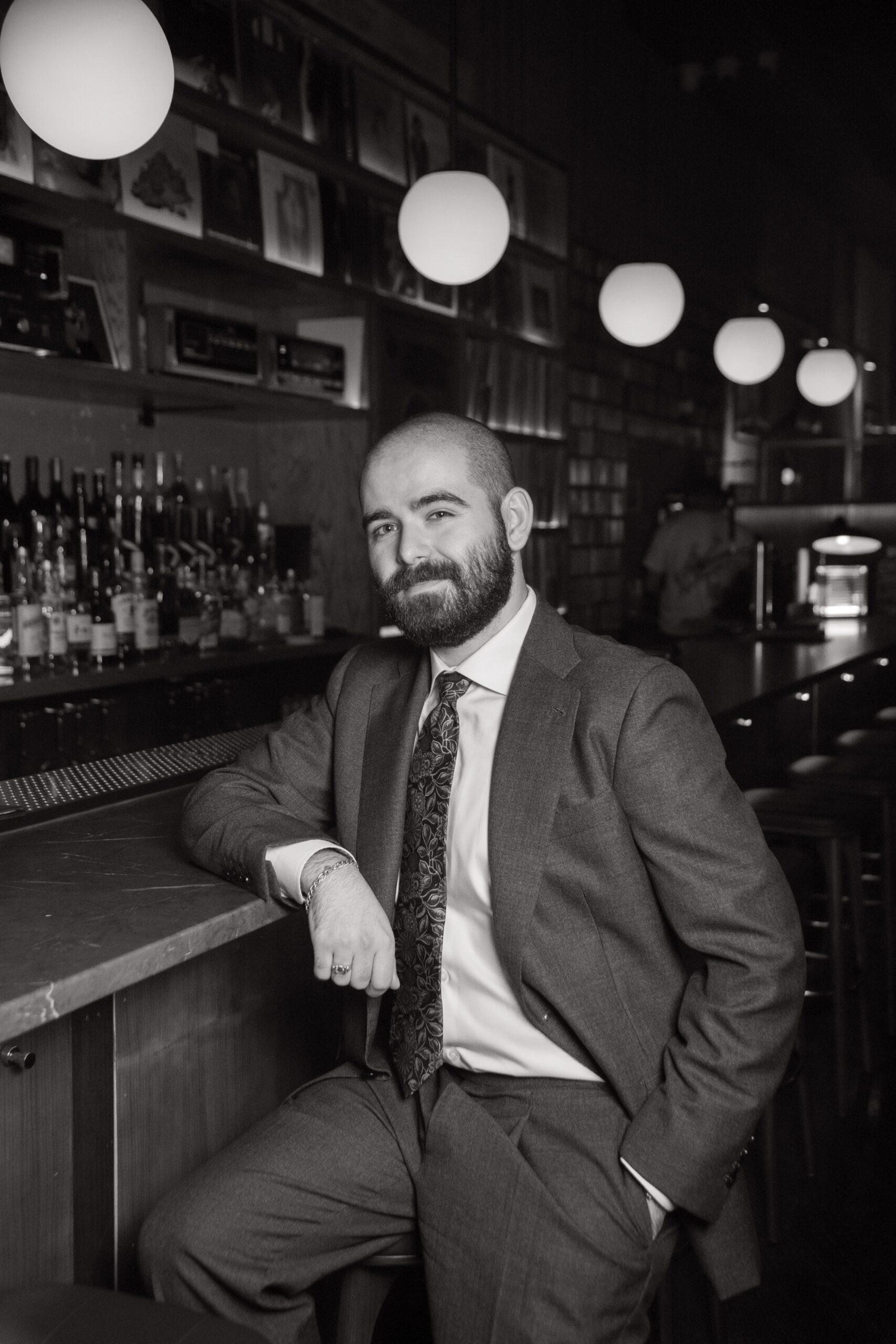 Jake Tennenbaum, Honkaku Spirits' National Sales Director, leans against the bar.